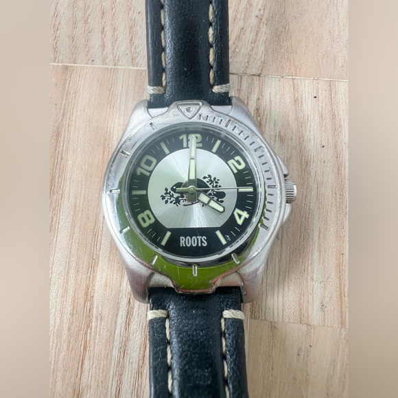 Roots Accessories - Roots Canada ladies silver tone black leather logo watch NEW BATTERY